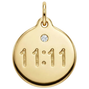 Gold pendant with '11:11' engraving and a diamond on a white background