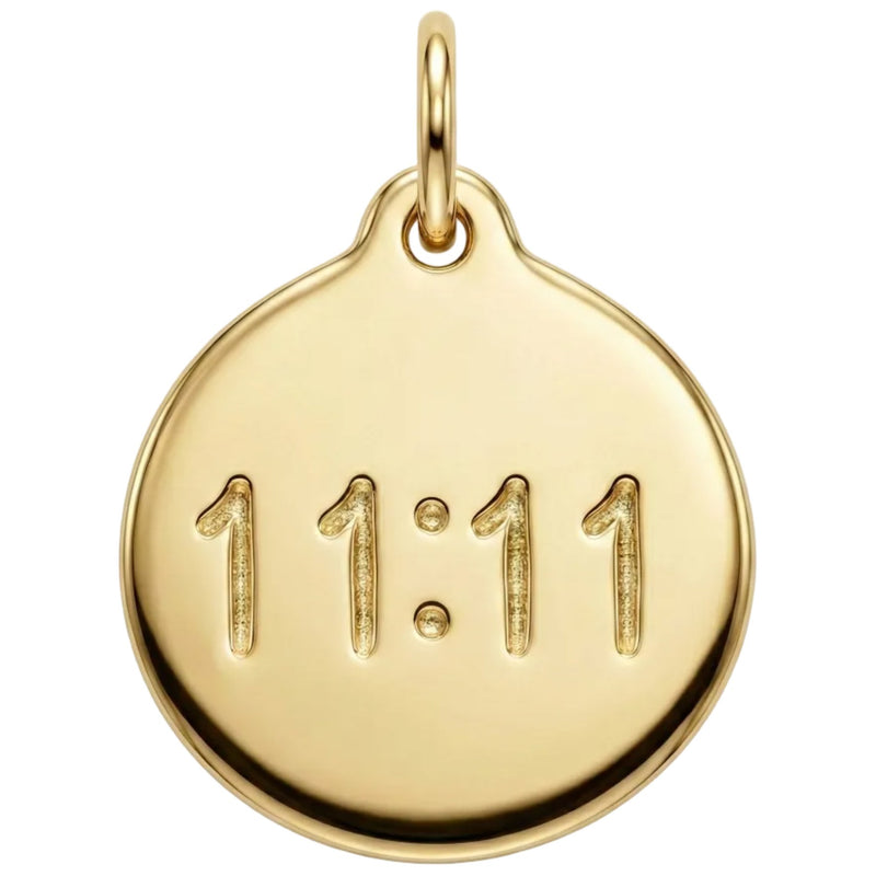Gold pendant with '11:11' engraving on a white background