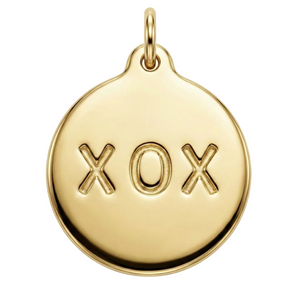 Gold pendant with 'XOX' engraving on a white background