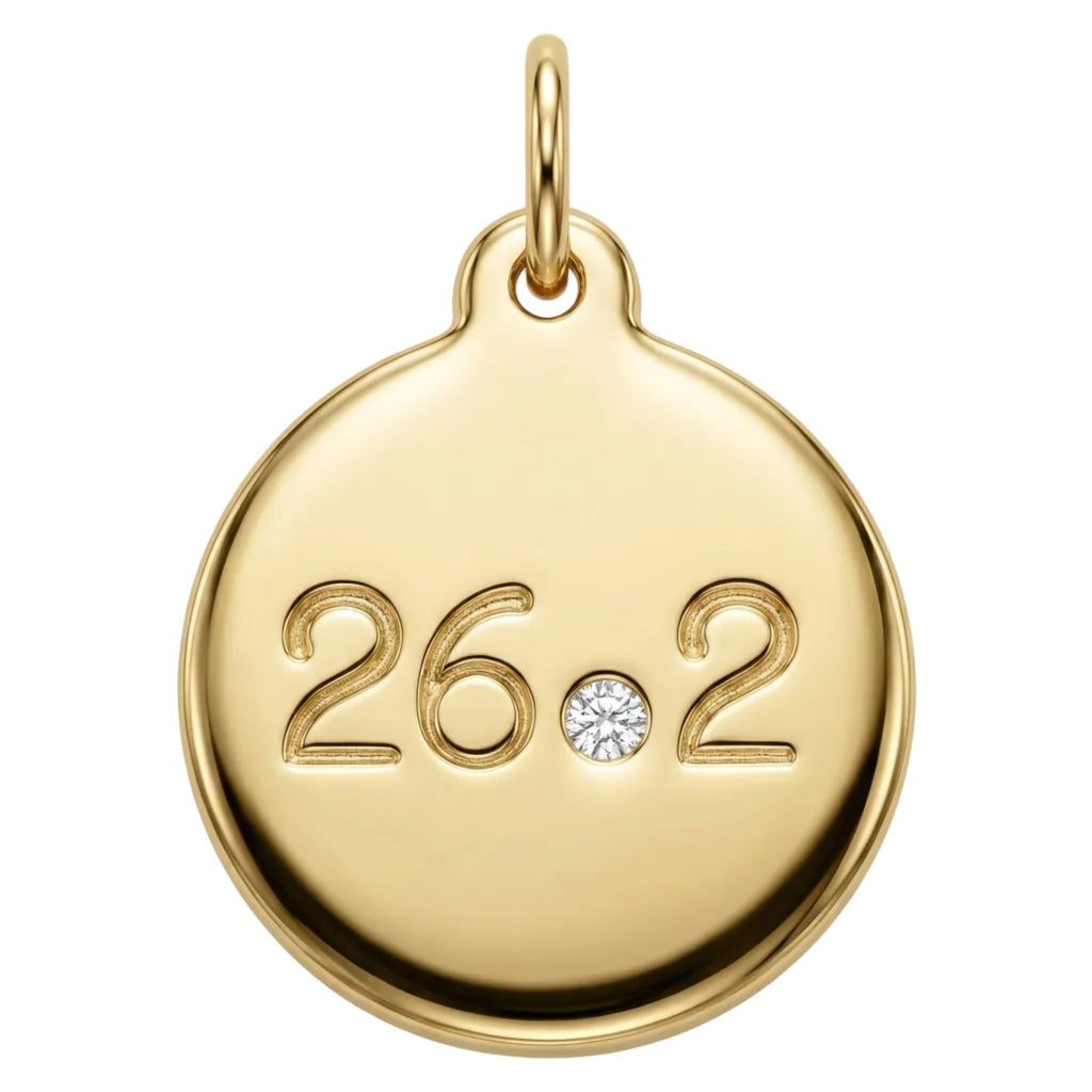 Gold pendant with '26.2' and a diamond on a white background