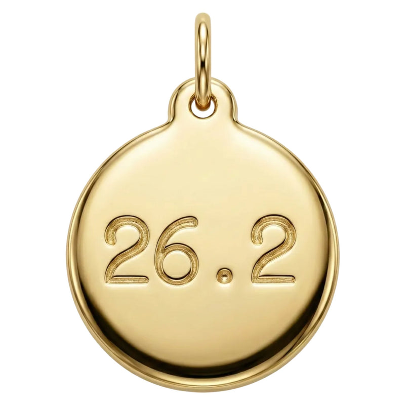 Gold pendant with engraved '26.2' on a white background