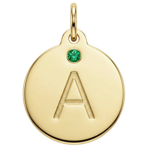 Gold pendant with letter 'A' and green gemstone on a white background