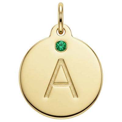 Gold pendant with letter 'A' and green gemstone on a white background