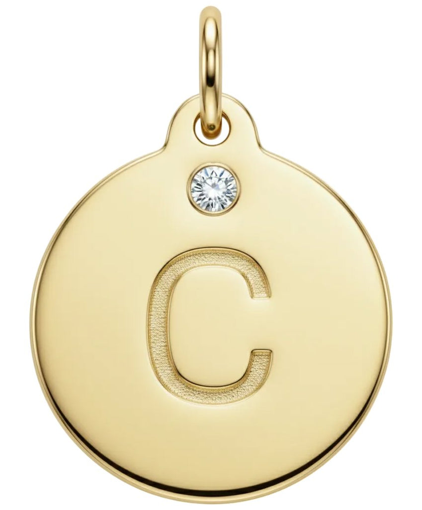 Gold pendant with letter 'C' and small diamond gemstone on a white background