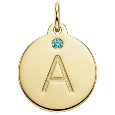 Gold pendant with letter 'A' and blue gemstone on a white background