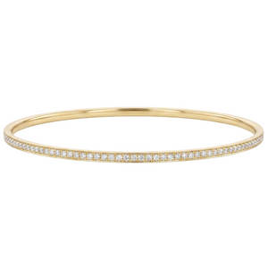 18k solid gold bracelet with small diamonds on a white background