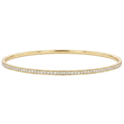 18k solid gold bracelet with small diamonds on a white background