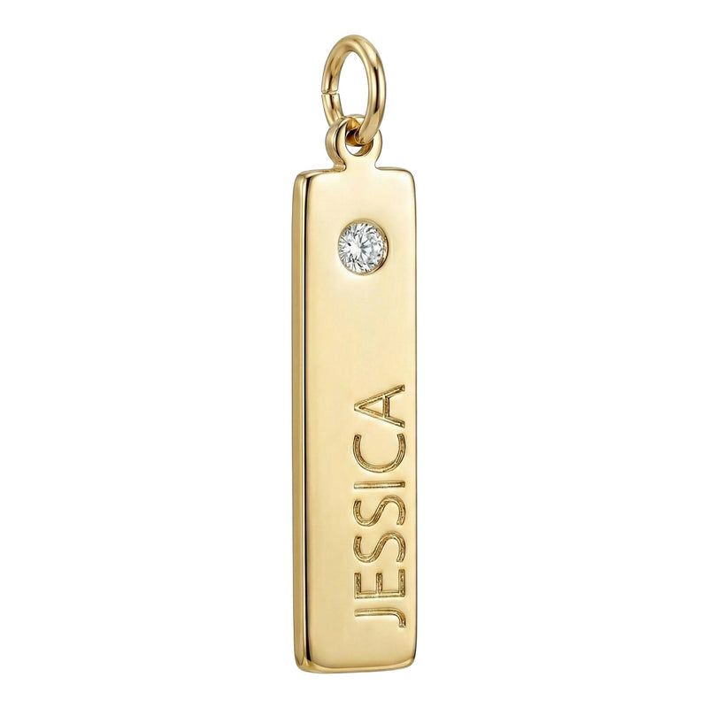 Gold pendant with 'JESSICA' engraved and a diamond on a white background