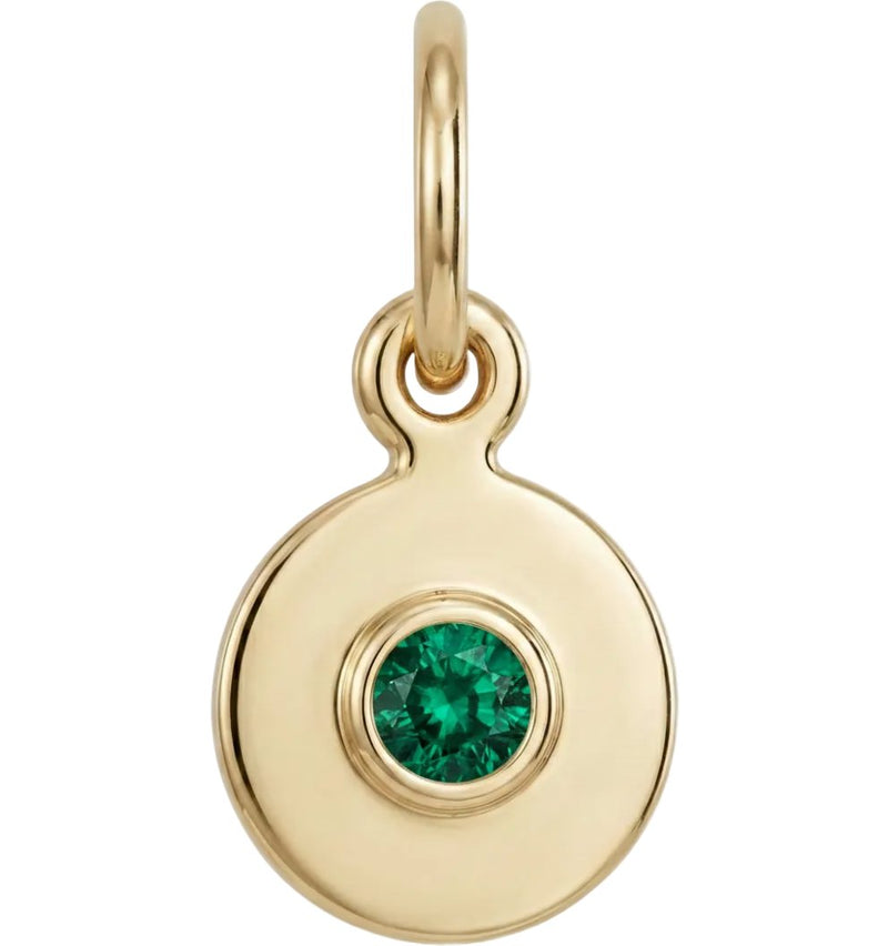 Gold pendant with a green gemstone on a white background