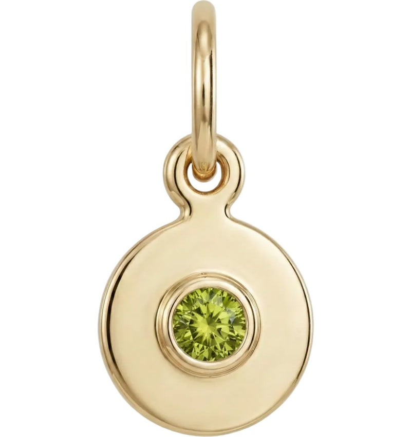 Gold pendant with a green gemstone on a white background