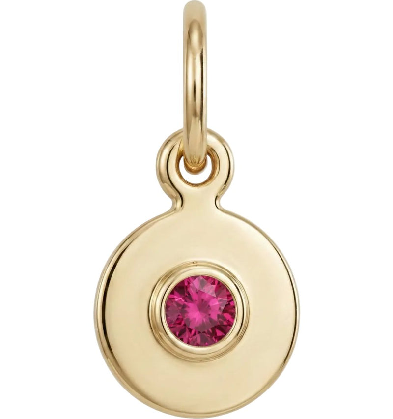 Gold pendant with a pink gemstone on a white background