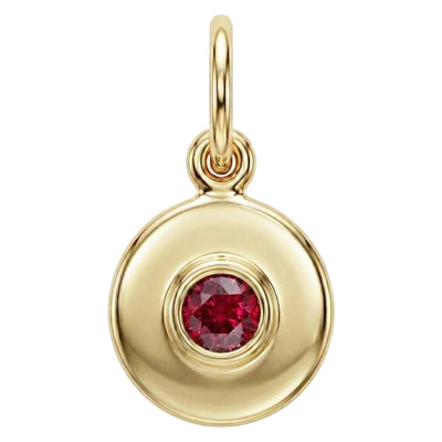 Gold pendant with a red gemstone on a white background