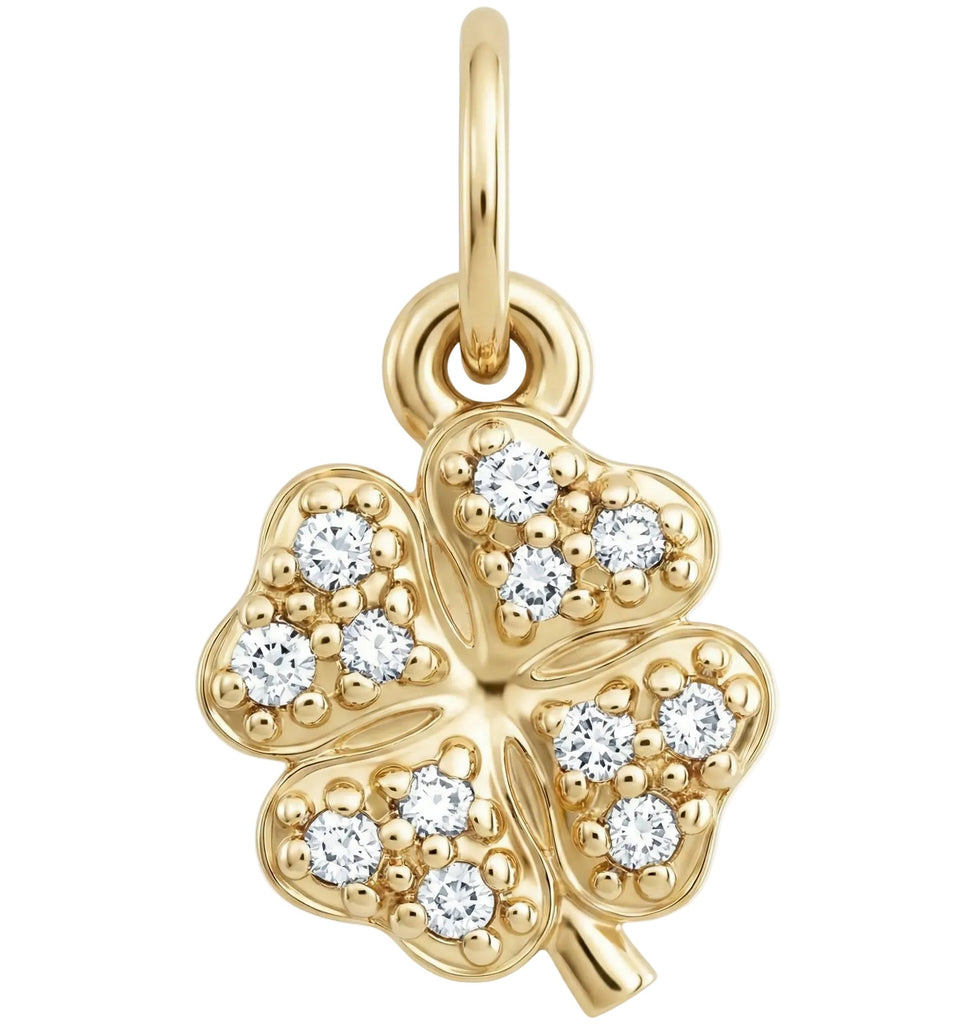 Gold four-leaf clover pendant with embedded diamonds on a white background