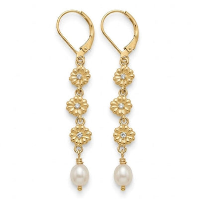 A pair of gold leverback drop earrings with floral motifs, small clear stones, and white pearl beads, shown against a plain white background.
