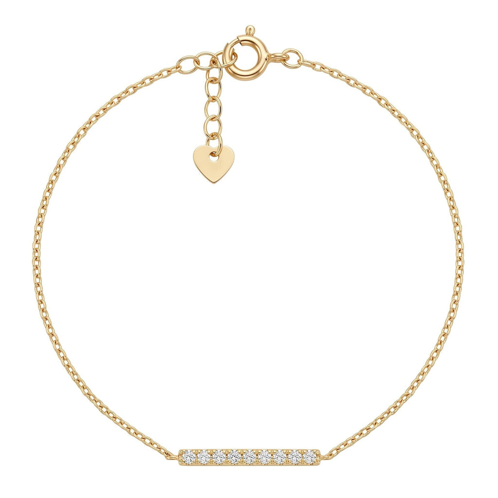 A delicate gold chain bracelet with a small horizontal bar set with clear stones at the bottom center and a small gold heart charm, shown on a plain white background.