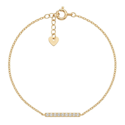 A delicate gold chain bracelet with a small horizontal bar set with clear stones at the bottom center and a small gold heart charm, shown on a plain white background.