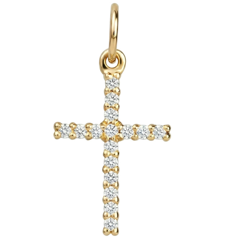 Gold cross pendant with diamonds on a white background