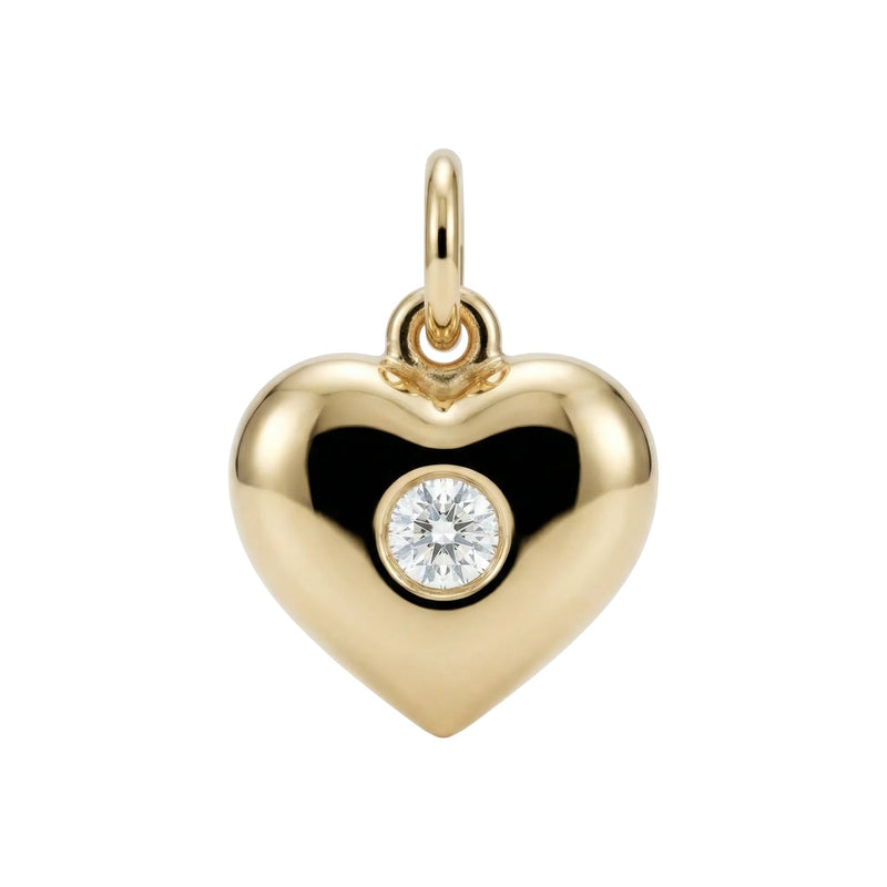 Gold heart-shaped pendant with a diamond on a white background