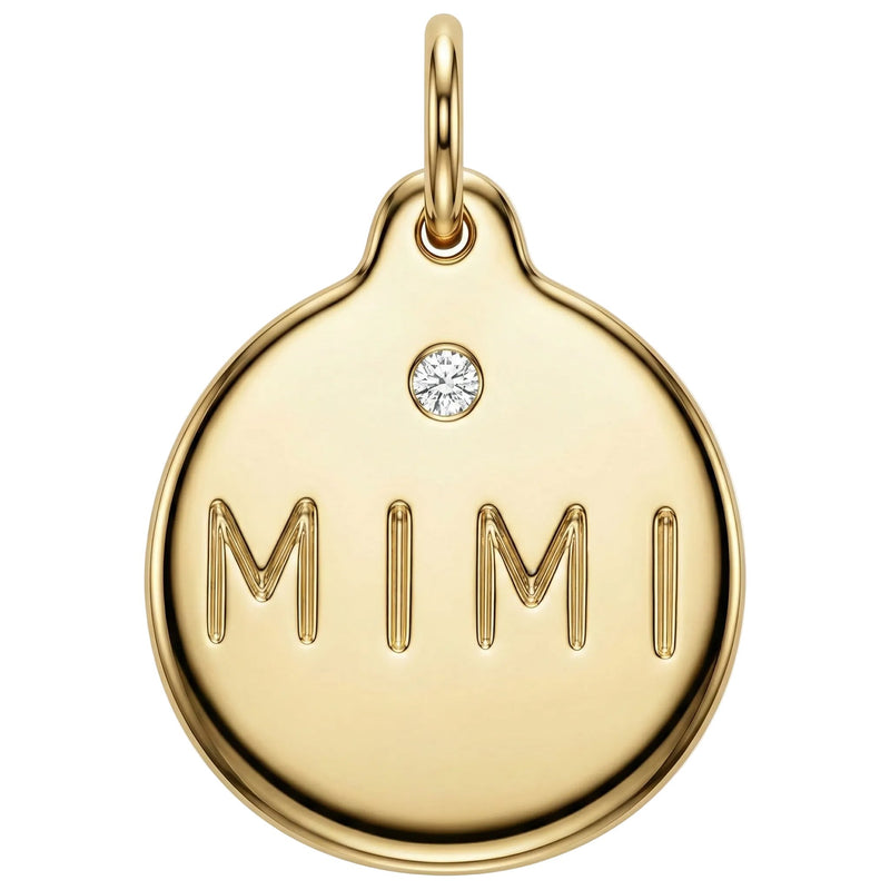 Gold pendant with 'MIMI' engraving and a diamond on a white background