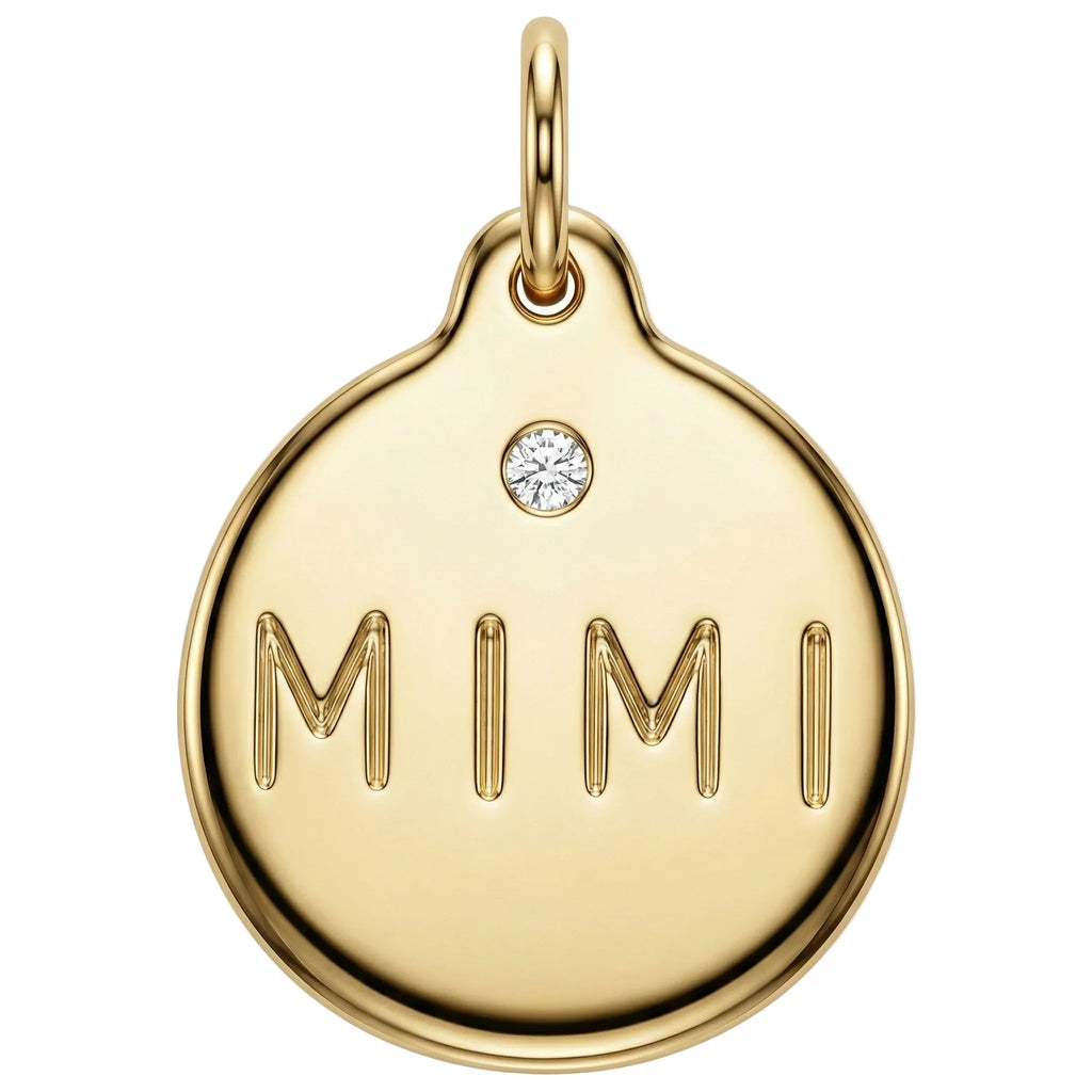 Gold pendant with 'MIMI' engraving and a diamond on a white background