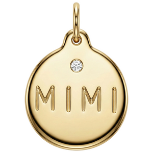 Gold pendant with 'MIMI' engraving and a small diamond on a white background