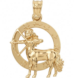 A gold-toned astrology pendant featuring the Libra zodiac sign, depicting a Libra archer within a circular astrological wheel decorated with stars.