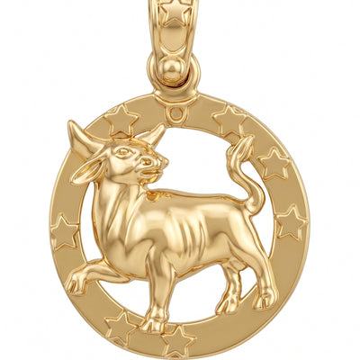 A gold pendant featuring a bull silhouette inside a circular frame decorated with stars, shown on a plain white background.