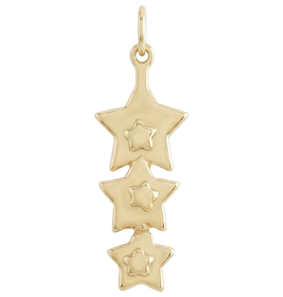 Gold star-shaped pendant on a white background