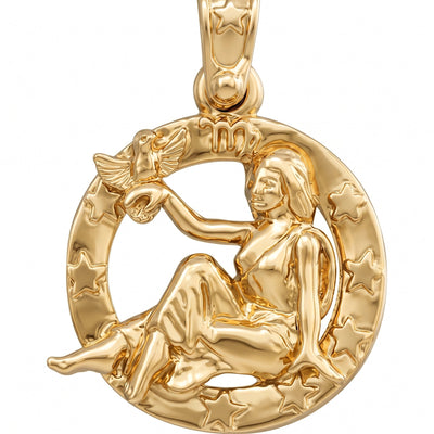 A polished yellow gold pendant featuring a zodiac symbol for Libra, depicting a seated woman holding a star, set against a circular background of stars.