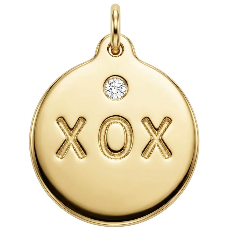 Gold pendant with 'XOX' engraving on a white background