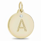 Gold pendant with letter 'A' and diamond on a white background