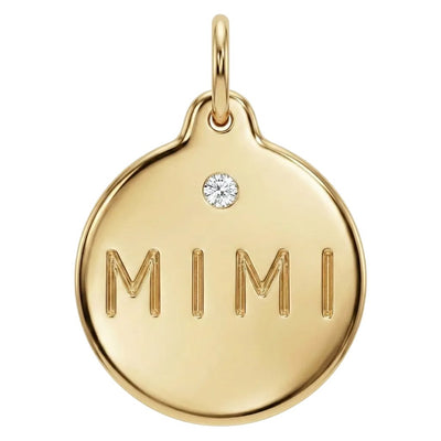 Gold pendant with 'MIMI' engraving and a diamond on a white background