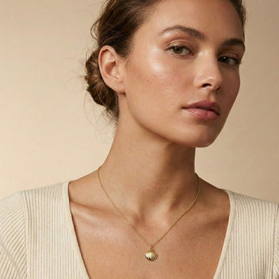 14k scallop shell charm on necklace on model