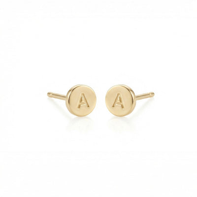 Gold earrings with 'A' initials on a white background