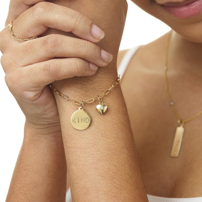 Helen Ficalora's Kind Disk Charm lovingly crafted in New York. Made With Solid 14k Gold. Gift Wrapped. Free Express Shipping. Custom Engraving.